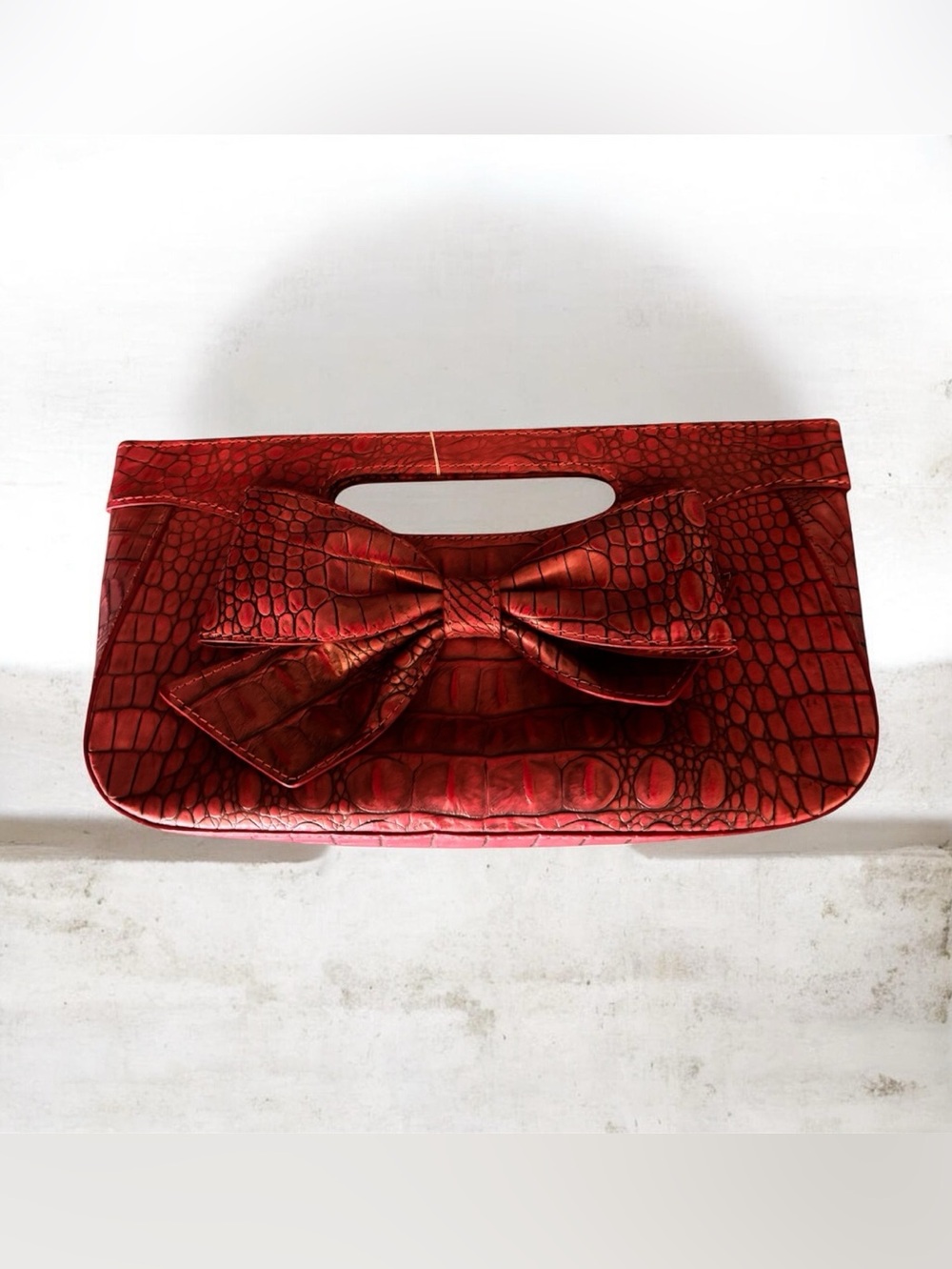 Isabella Fiore Kamila mock-crocodile embossed leather clutch